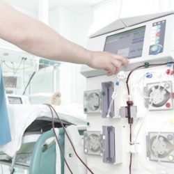 Doctor controls the process of dialysis in hospital